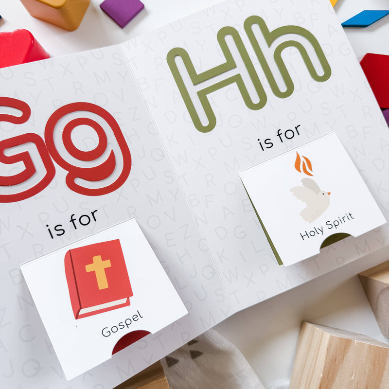 Educational cards with letters 'G' and 'H', a cross, and dove on a white background.