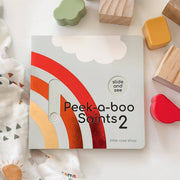 Children's book titled 'Peek-a-boo Points 2' by Little Rose Shop with colorful shapes around it.