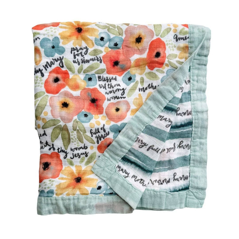 Floral patterned blanket with text on a white background